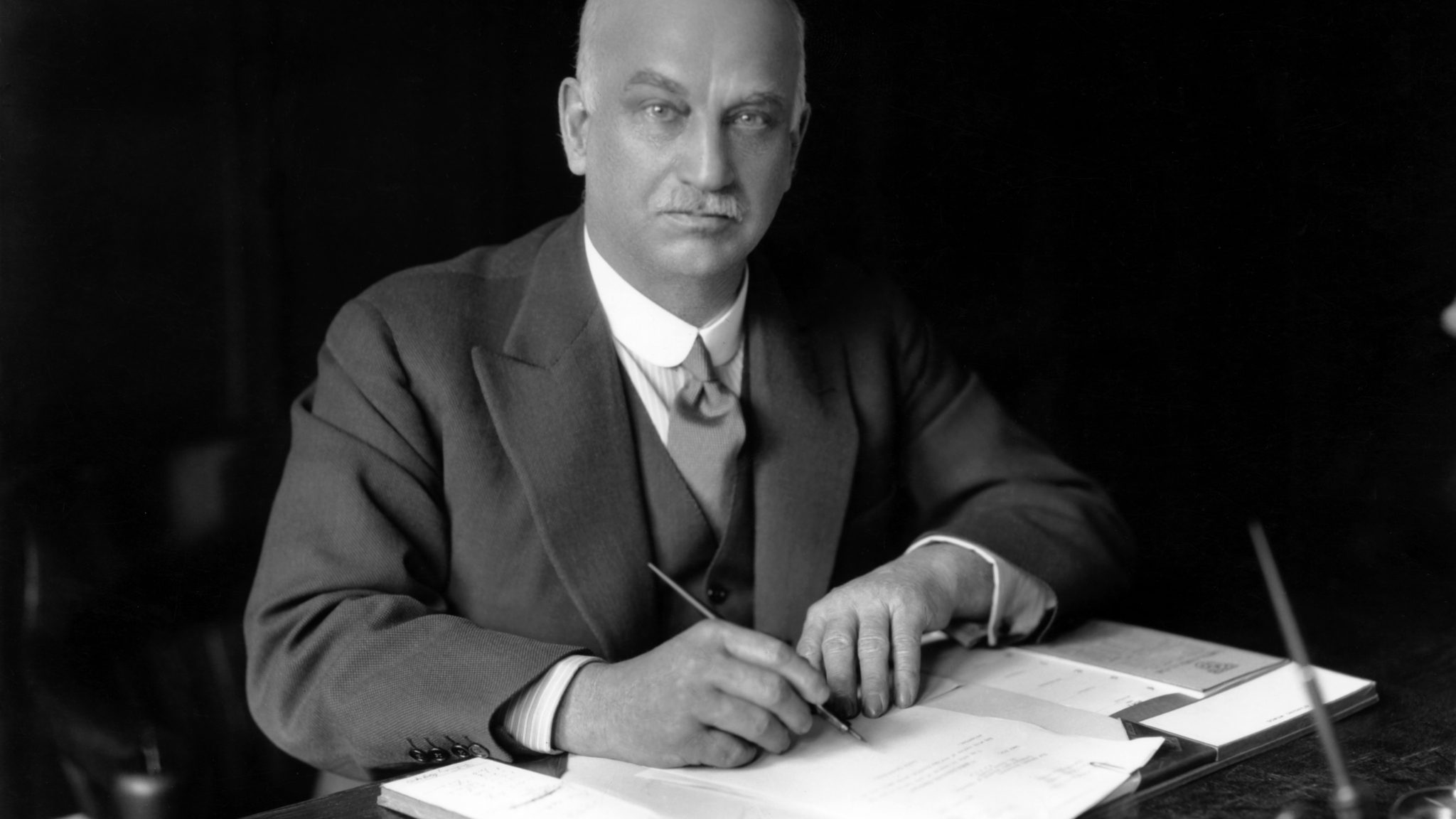 Sir Herbert Austin 1936. Founder of the Austin Motor Company at his desk in the Longbridge factory.